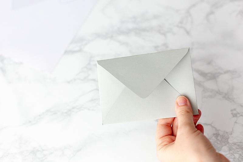  Fold the top flap down and crease it as well. 